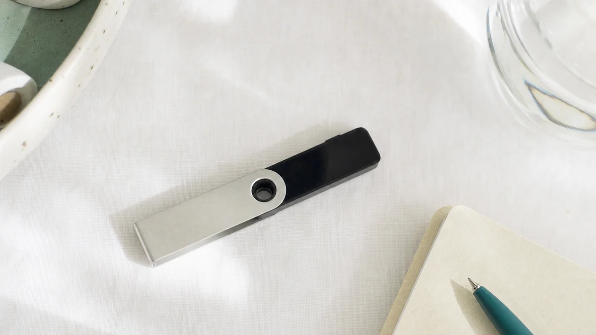 AI-generated editorial image for Ledger Device Safety Concerns Meet Bitcoin’s Old Guard, covering digital gold comparison, hardware wallet…