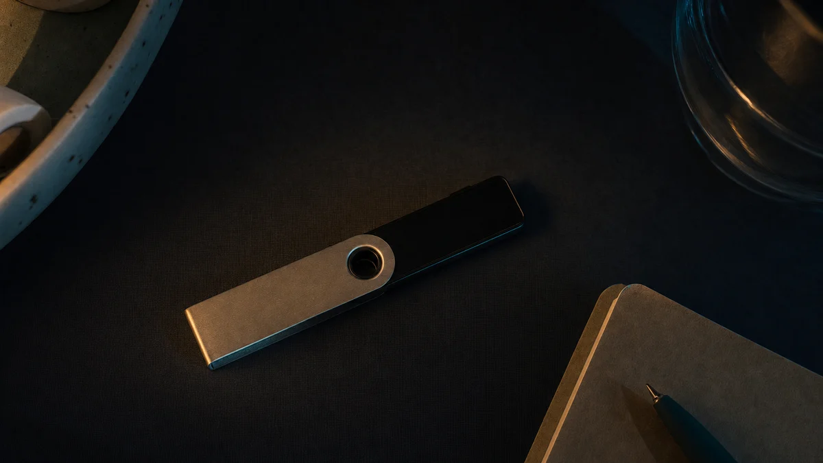 AI-generated editorial image for Ledger Device Safety Concerns Meet Bitcoin’s Old Guard, covering digital gold comparison, hardware wallet…
